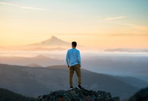 Man contemplating becoming a Millionaire and being on top of the world