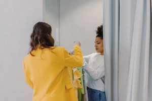 2 ladies using fitting room